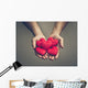 old hands of the elderly giving a red heart Wall Mural