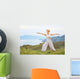 Senior woman doing yoga exercises Wall Mural