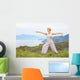 Senior woman doing yoga exercises Wall Mural