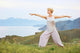 Senior woman doing yoga exercises Wall Mural