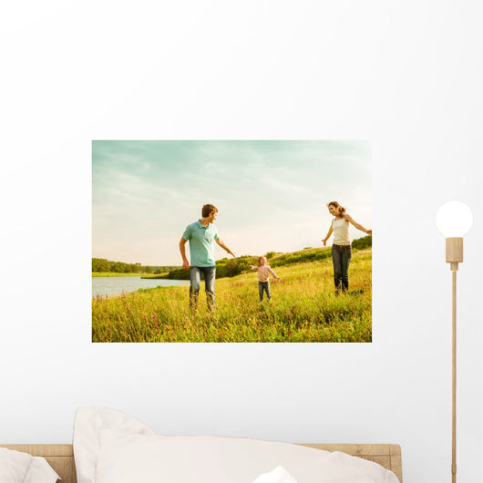 happy family having fun outdoors Wall Mural