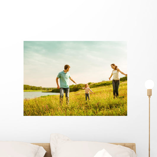 happy family having fun outdoors Wall Mural