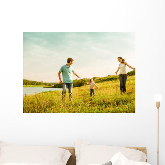 happy family having fun outdoors Wall Mural