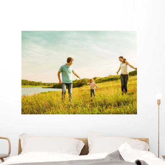 happy family having fun outdoors Wall Mural