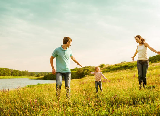 happy family having fun outdoors Wall Mural