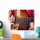 Closeup of girl´s hands playing acoustic quitar Wall Mural