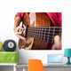Closeup of girl´s hands playing acoustic quitar Wall Mural