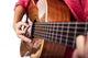 Closeup of girl´s hands playing acoustic quitar Wall Mural
