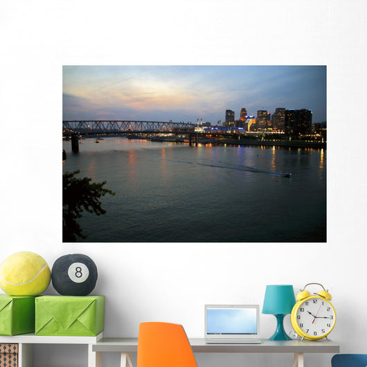 Cincinnati skyline from Newport, KY with riverboat at night. Wall Mural