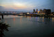 Cincinnati skyline from Newport, KY with riverboat at night. Wall Mural