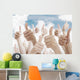 Many people holding their thumbs up Wall Mural