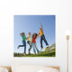 Happy teens jump in air. Wall Mural