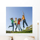 Happy teens jump in air. Wall Mural