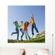 Happy teens jump in air. Wall Mural