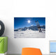 Skis in snow at Mountains Wall Mural