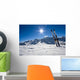 Skis in snow at Mountains Wall Mural
