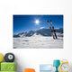 Skis in snow at Mountains Wall Mural