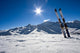 Skis in snow at Mountains Wall Mural