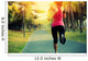 woman runner running at tropical park Wall Mural
