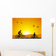 Mountain bike at sunset with child Wall Mural