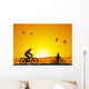Mountain bike at sunset with child Wall Mural