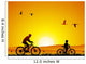 Mountain bike at sunset with child Wall Mural