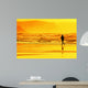 person running on beach at sunset Wall Mural