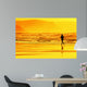 person running on beach at sunset Wall Mural