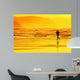person running on beach at sunset Wall Mural