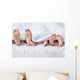 Feet of a family sticking out from the white quilt Wall Mural