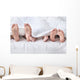Feet of a family sticking out from the white quilt Wall Mural