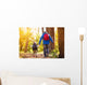 Father and son walking in autumn forest Wall Mural