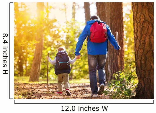 Father and son walking in autumn forest Wall Mural