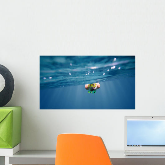 Underwater portrait of a woman snorkeling Wall Mural