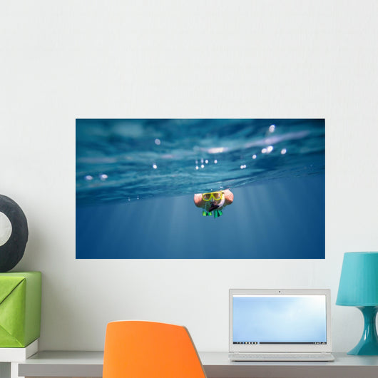 Underwater portrait of a woman snorkeling Wall Mural