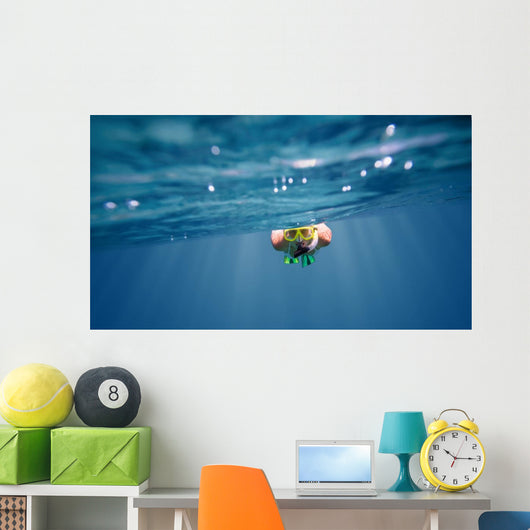 Underwater portrait of a woman snorkeling Wall Mural