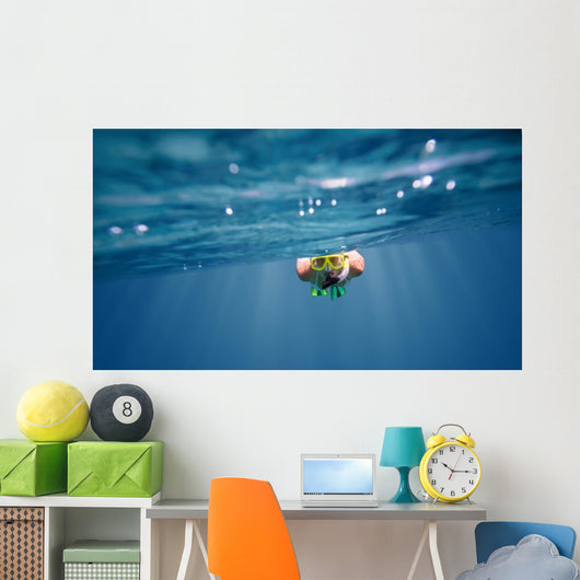 Underwater portrait of a woman snorkeling Wall Mural