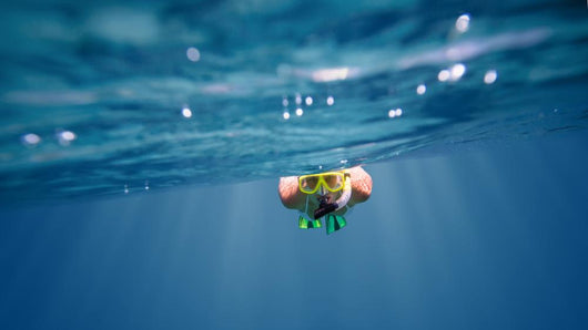 Underwater portrait of a woman snorkeling Wall Mural