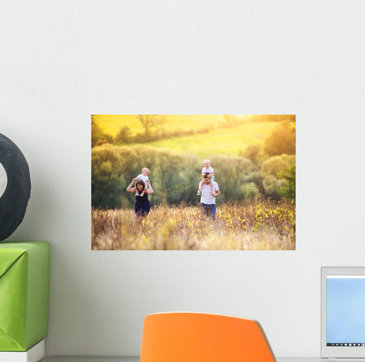 Family enjoying life together outside Wall Mural