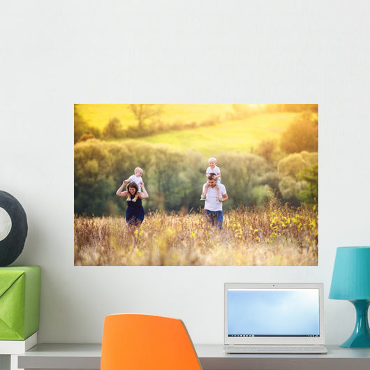 Family enjoying life together outside Wall Mural