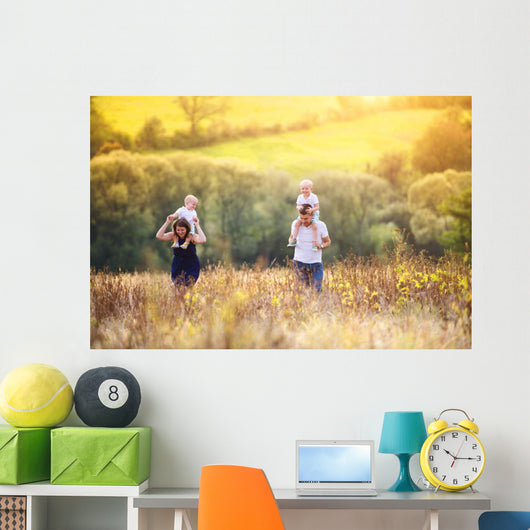 Family enjoying life together outside Wall Mural