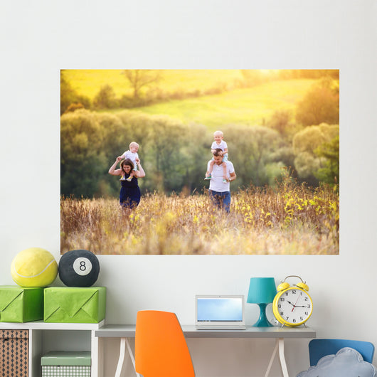 Family enjoying life together outside Wall Mural