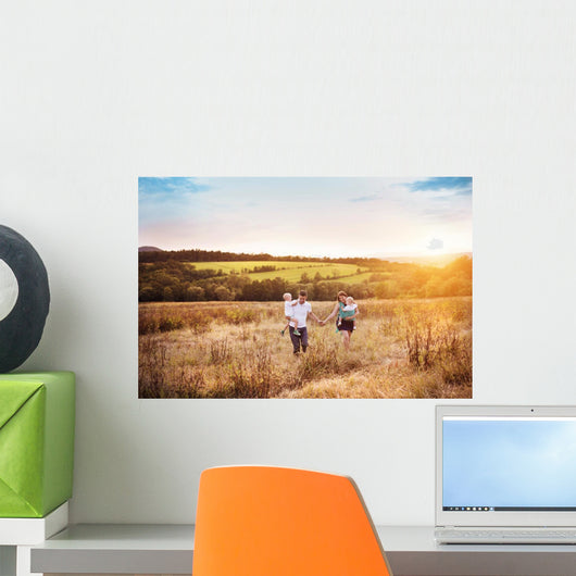 Family enjoying life together outside Wall Mural
