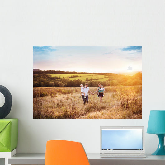 Family enjoying life together outside Wall Mural