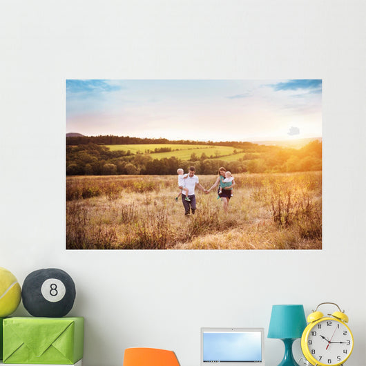 Family enjoying life together outside Wall Mural