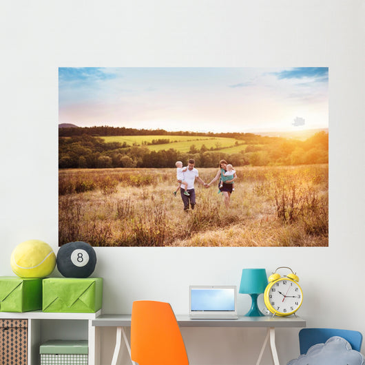 Family enjoying life together outside Wall Mural