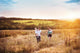 Family enjoying life together outside Wall Mural