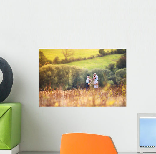 Family enjoying life together outside Wall Mural