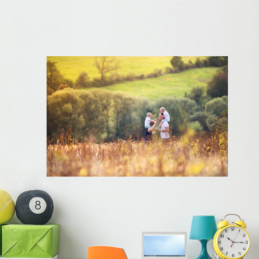 Family enjoying life together outside Wall Mural