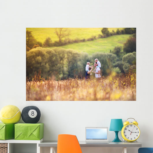 Family enjoying life together outside Wall Mural